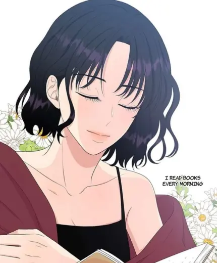 Young woman with black hair reading a book