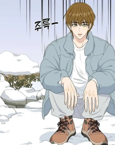 Young man sitting in a squat position outside in winter time